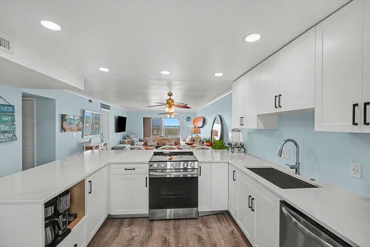 Renovated kitchen with quartz counters and solid wood cabinetry