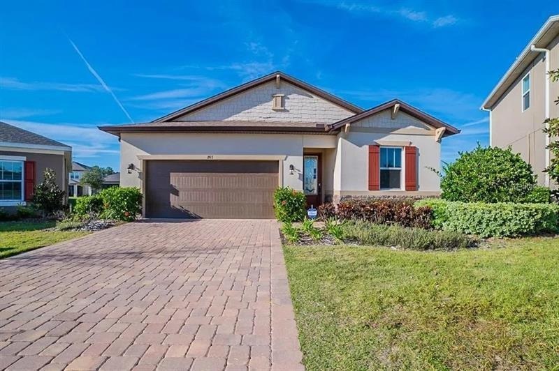 Front elevation of 203 Sangmon Court, a one-story home in Groveland, Florida