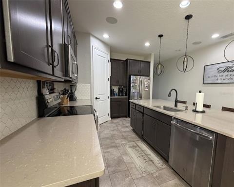 Kitchen with stone counters and centre island